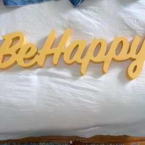 “Be happy” yellow script sign for home decor